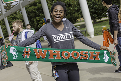 Rachael Mukweyi, an actuarial science freshman, proudly displayed her UT Dallas Comets scarf and a smile on the mall. Founders Day | Fall 2017
